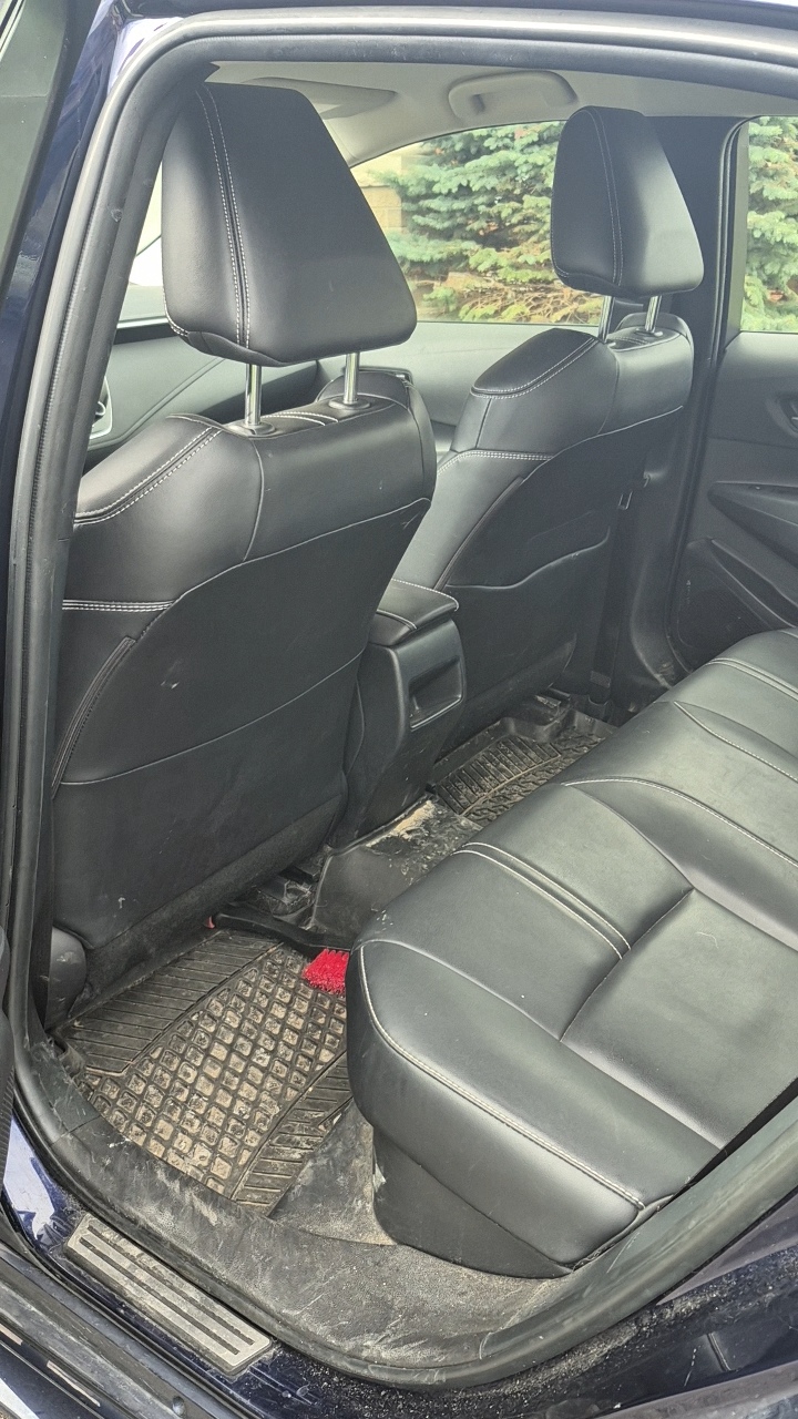 Driver seat area before detailing — worn dirty seat with stains and grime